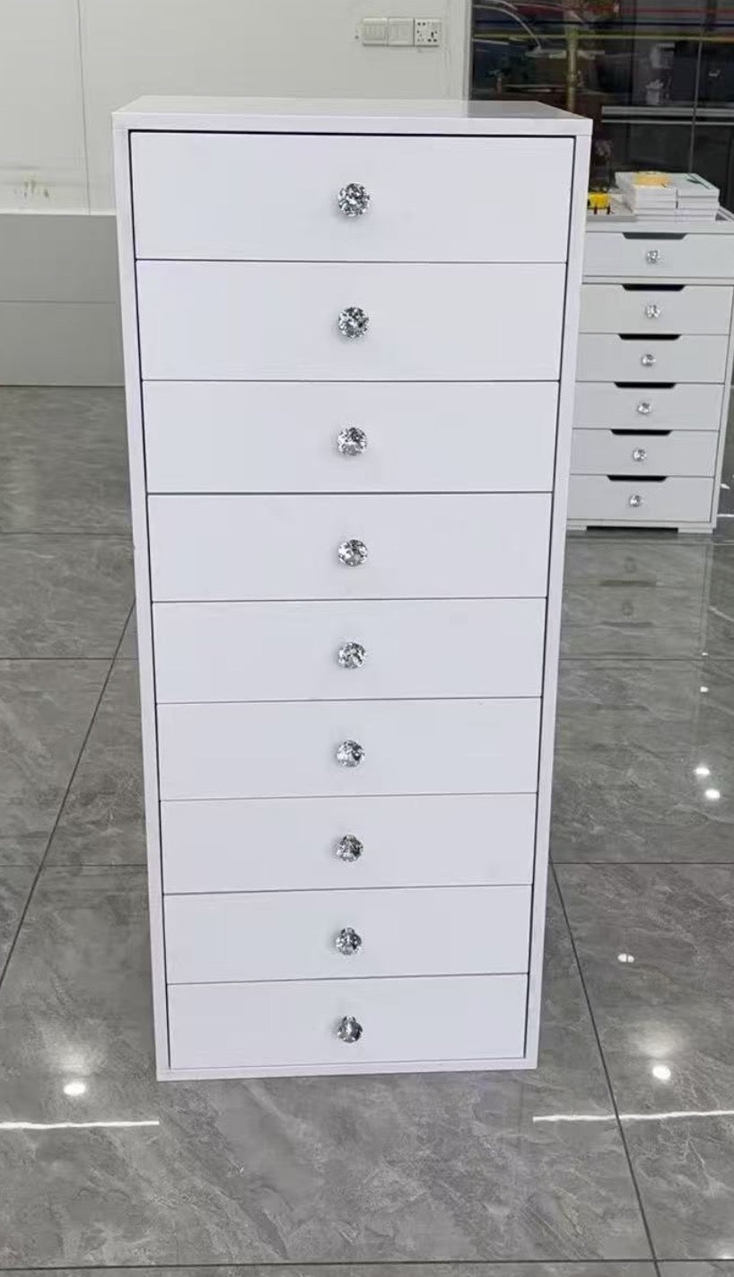 9 drawer makeup storage tower with a high-gloss finish, smooth-glide drawers and crystal-style knobs for organising cosmetics, skincare, jewellery and beauty essentials.