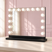 The Seraphina Mirror: Black Edition in a soft blush pink setting