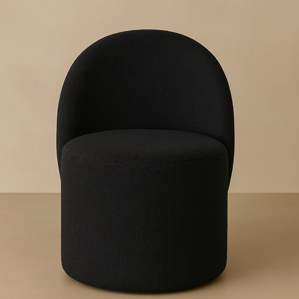 Black bouclé dressing table chair with a rounded backrest, 360° swivel and plush cushioning for makeup stations, beauty rooms and bedrooms.