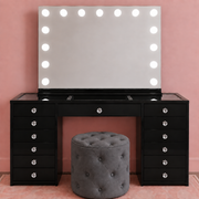 Complete black Hollywood makeup vanity set with LED mirror, spacious storage drawers, glass top and premium ottoman for a glamorous beauty setup — with clear faceted crystal drawer knobs.