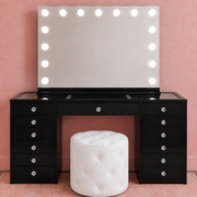 Luxury black makeup vanity set featuring a high-gloss Black Out Beauty vanity, Luna Luxe LED mirror and Marshmellow ottoman for modern beauty rooms — with clear faceted crystal drawer knobs.