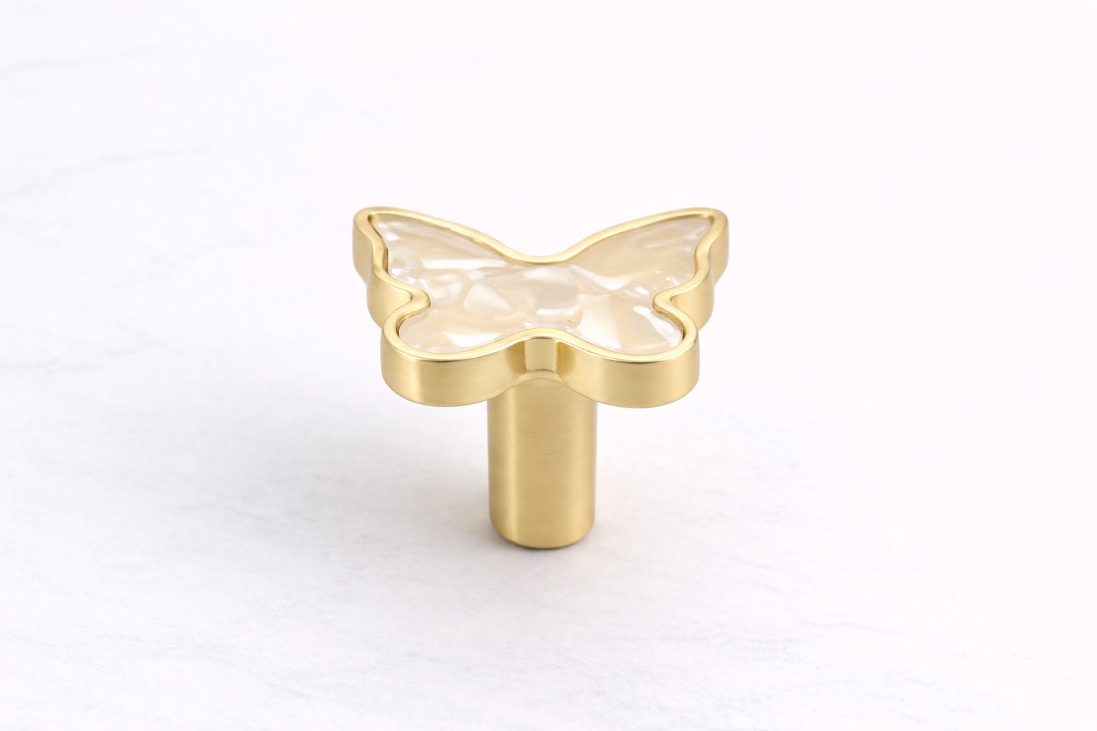 Butterfly Stone Vanity Knob with a stone-effect butterfly design and brushed gold zinc alloy frame, perfect for vanities, dressers, drawers and cabinets by Vanity Vault.