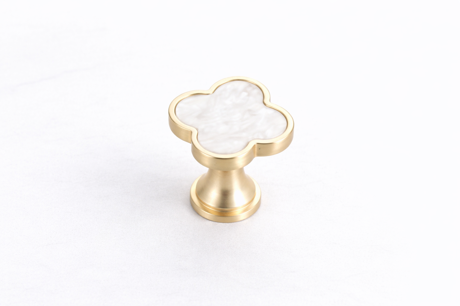 Elegant Clover Vanity Knob with a clover-shaped stone-effect design and brushed gold zinc alloy frame, perfect for vanities, dressers, drawers and cabinets by Vanity Vault.