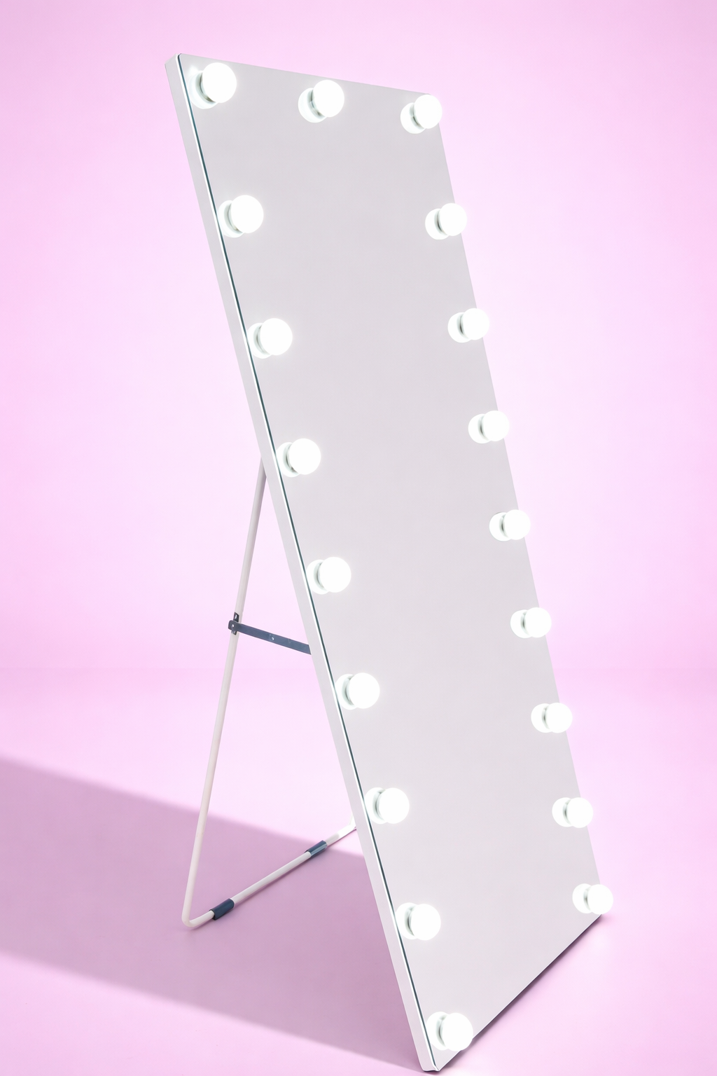 Glamour Glow Hollywood full-length mirror with 22 LED lights, dimmable brightness, three adjustable light settings and a freestanding design for bedrooms, dressing rooms and beauty spaces by Vanity Vault.