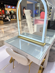 Heaven Sent Collection with a gold Mini Aries illuminated mirror, Halo Haven glass-top vanity and white Candy Cloud Lounge Seat