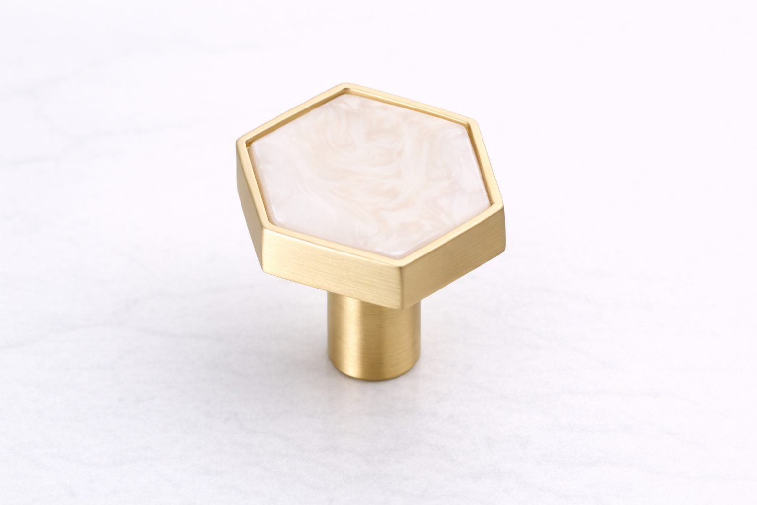 Modern hexagon cabinet knob featuring a stone-effect insert, brushed gold finish and durable zinc alloy construction for vanity drawers and furniture.