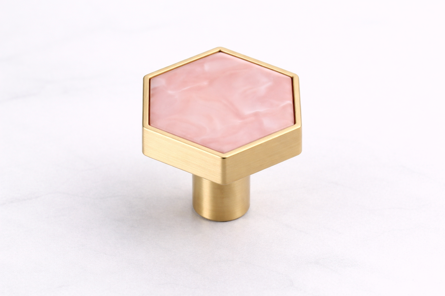 Hexagon Stone Cabinet Knob with a textured stone-effect inlay and brushed gold zinc alloy frame, ideal for vanities, dressers, drawers and cabinets by Vanity Vault.