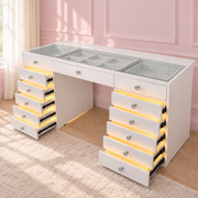 Luxury dressing table with a flush glass top, LED-lit drawers, spacious storage and a premium high-gloss finish for glamorous beauty spaces.