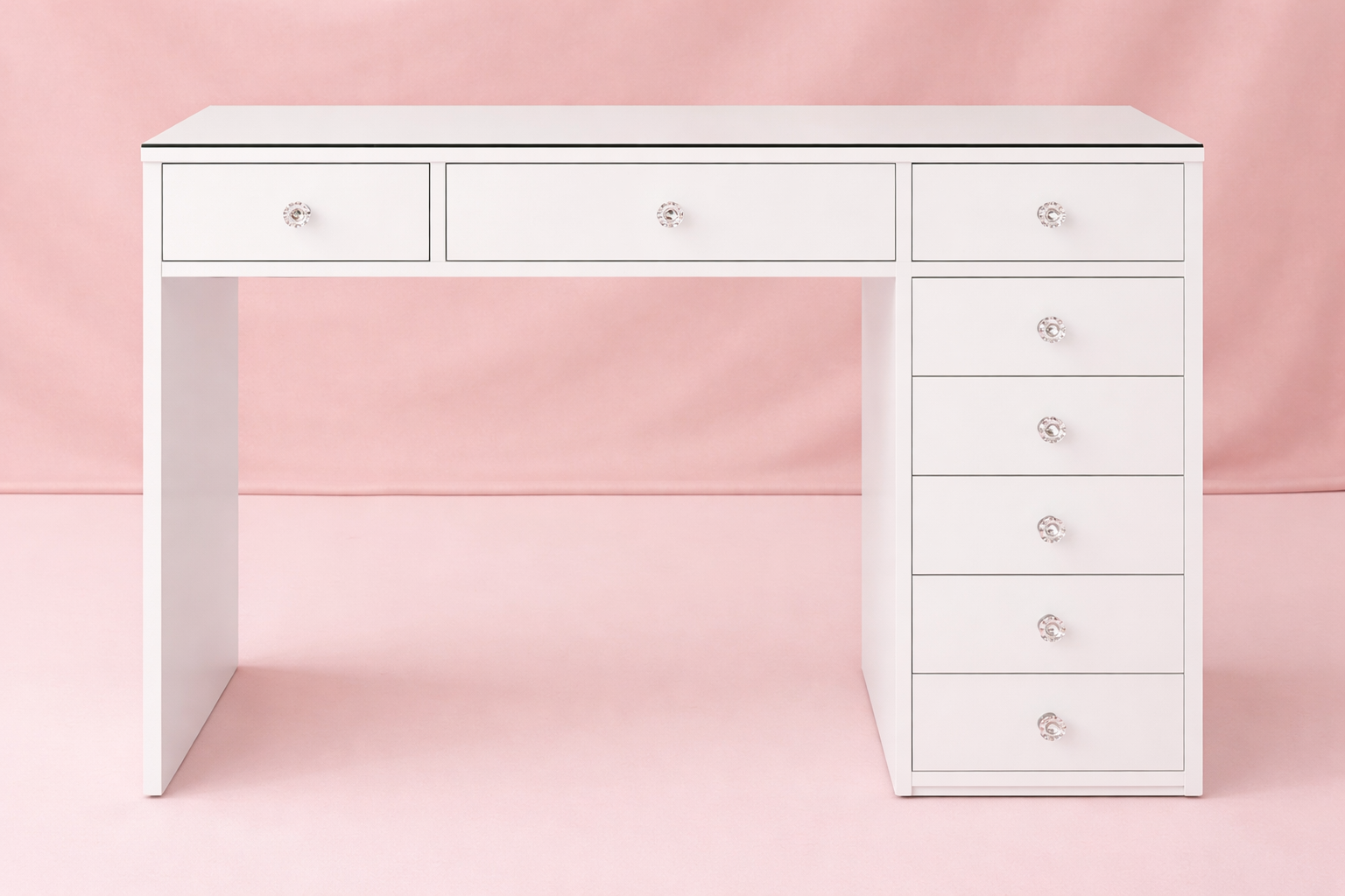 Mini Deluxe compact makeup vanity with a premium high-gloss finish, flush glass top, crystal-style drawer knobs and built-in storage compartments for bedrooms, apartments and beauty rooms by Vanity Vault.