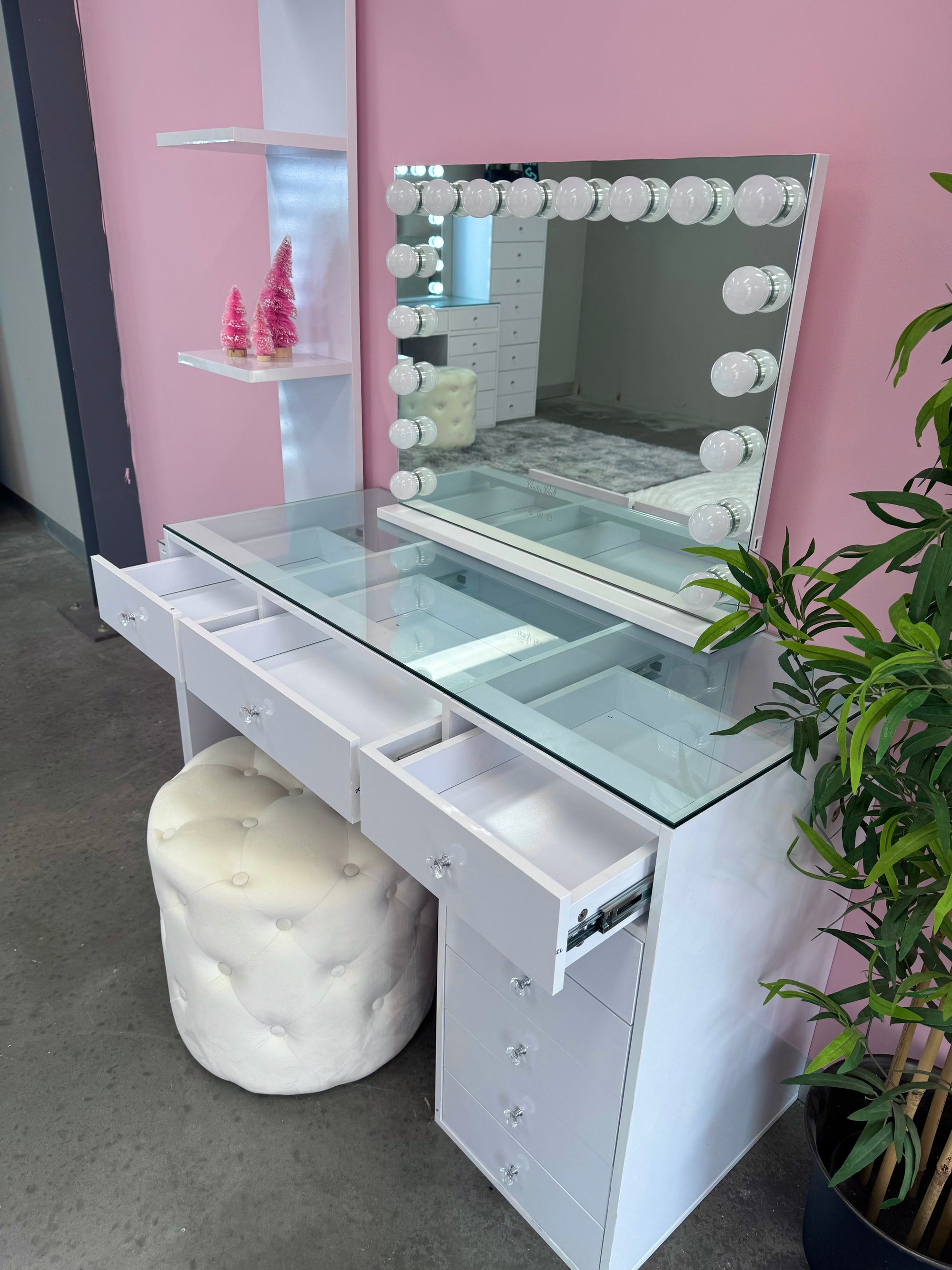 Mini makeup vanity with built-in storage compartments, smooth-glide drawers, a flush glass top and a premium high-gloss finish for compact beauty spaces.