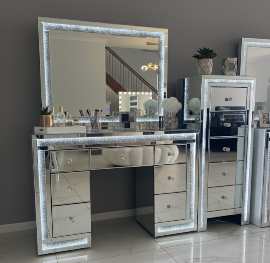 Luxury mirrored LED tallboy with crushed crystal trim, crystal drawer knobs and spacious storage drawers for glamorous bedrooms and dressing rooms.