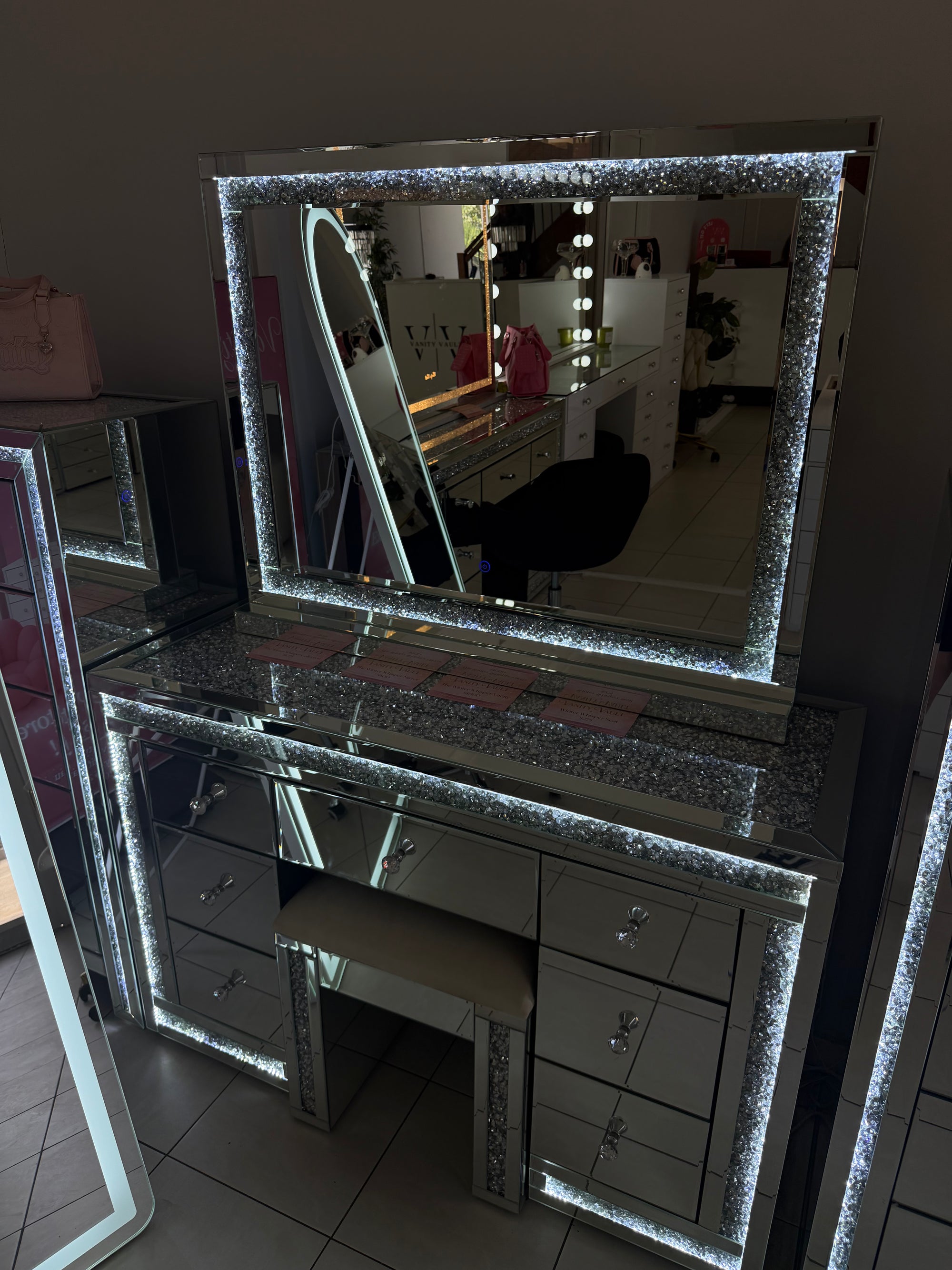 Luxury mirrored LED makeup mirror with crushed crystal detailing, soft LED lighting and a glamorous mirrored frame for dressing tables and beauty rooms.