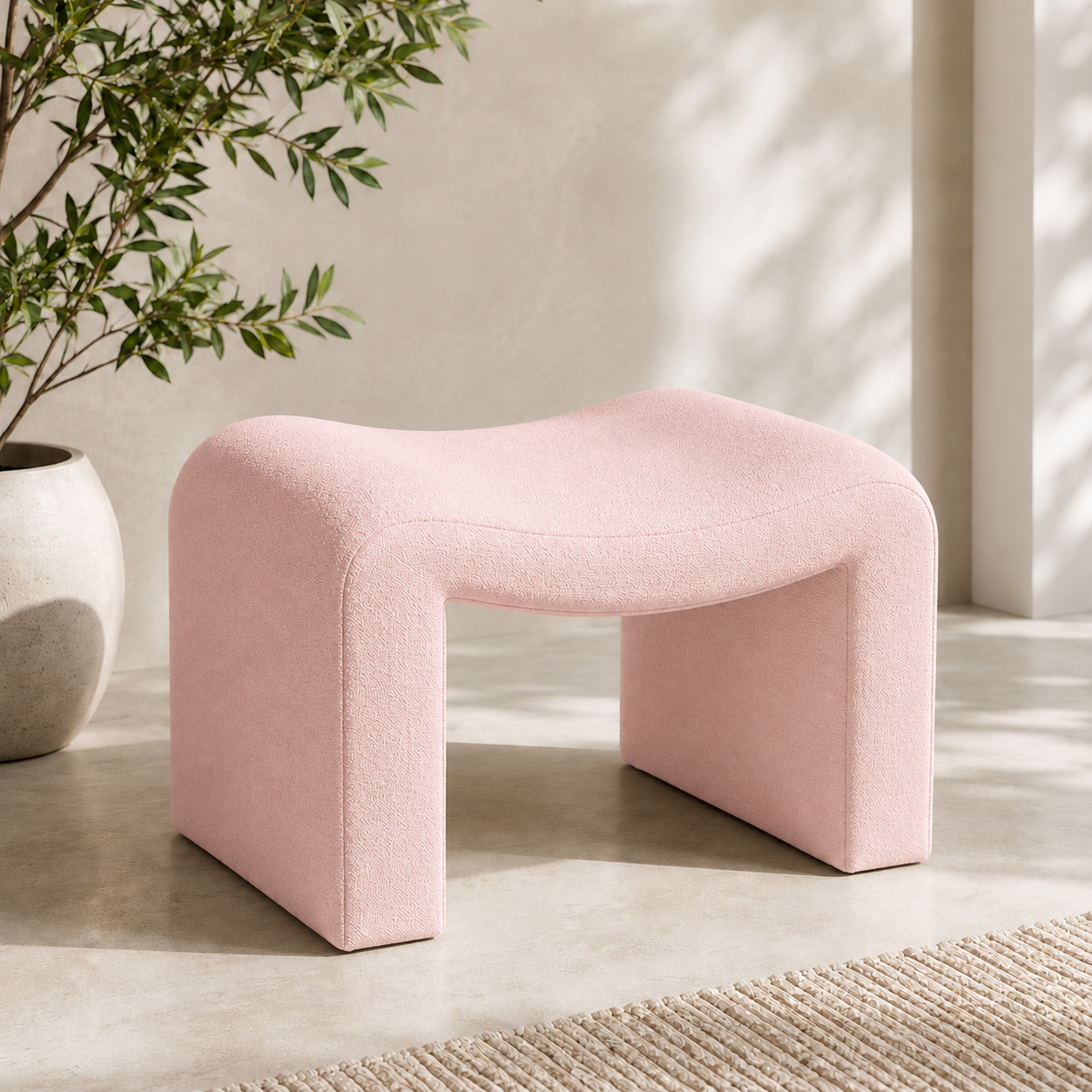 Modern Willow Curve vanity chair in blush pink featuring a curved bouclé upholstered seat for makeup vanities, dressing rooms and bedrooms.