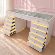 Professional makeup vanity station with LED-lit drawers, premium storage, flush glass top and a luxury high-gloss finish for beauty enthusiasts and content creators.