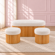 Sienna ottoman set with a white upholstered bench and two round stools on ribbed wood-coloured bases.