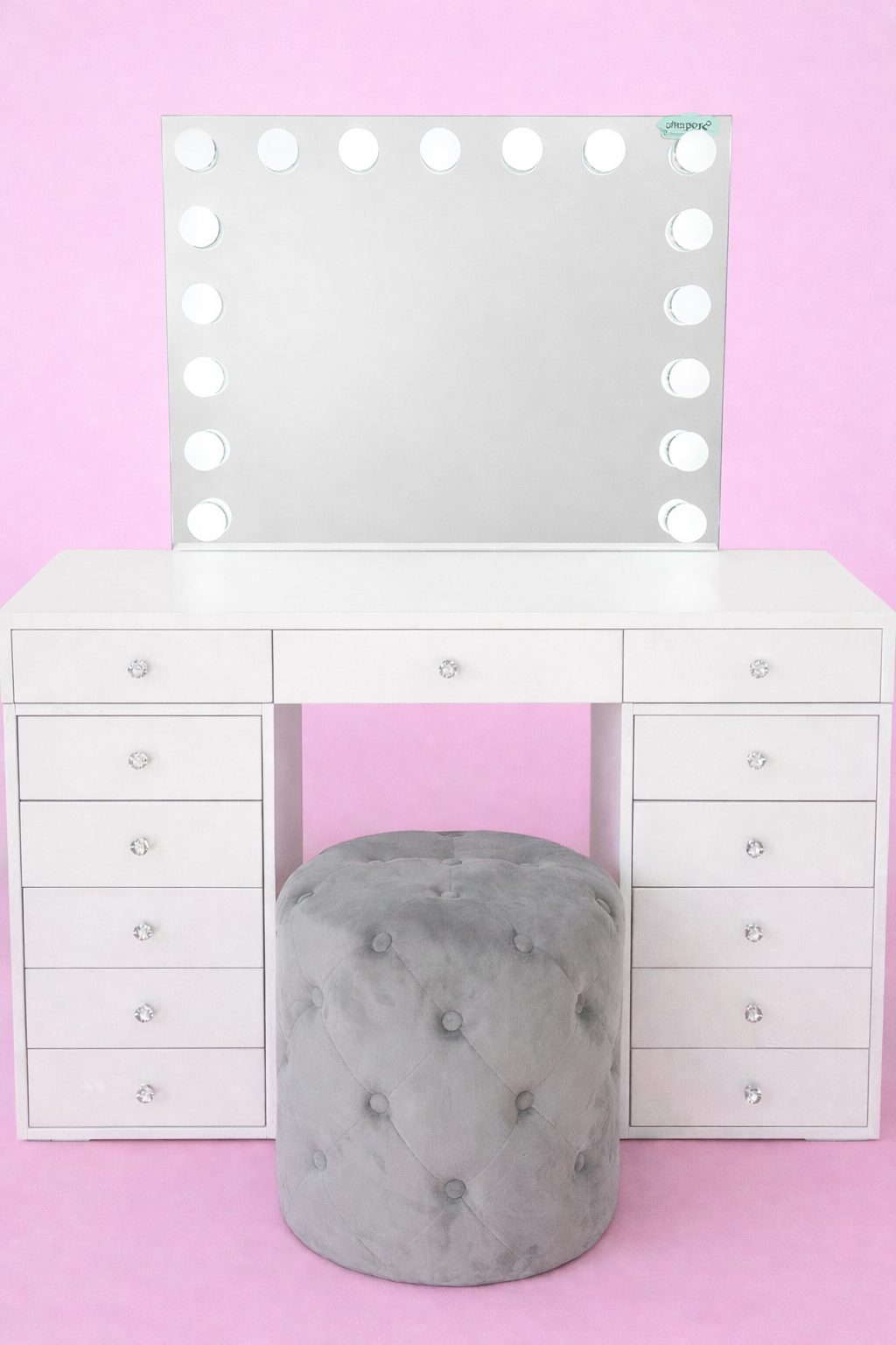 Small makeup vanity set featuring the Mini Dollface Vanity, LED Hollywood mirror and Marshmellow Ottoman with spacious storage for stylish beauty spaces.