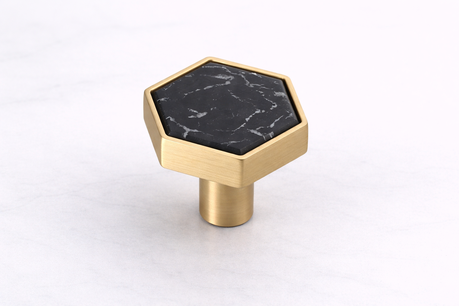 Stone-effect hexagon drawer knob with a brushed gold frame, designed to elevate vanities, wardrobes, dressers and cabinetry with a modern luxury finish.