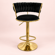 The Sitting Pretty Makeup Stool in black velvet with a gold base