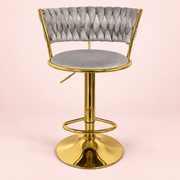The Sitting Pretty Makeup Stool in grey velvet with a gold base