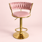 The Sitting Pretty Makeup Stool in pink velvet with a gold base