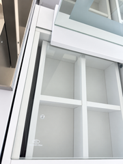 Close-up of the glass inset sitting flush within the white desktop surround