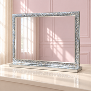 The Winter Whisper Mirror in a soft blush pink setting